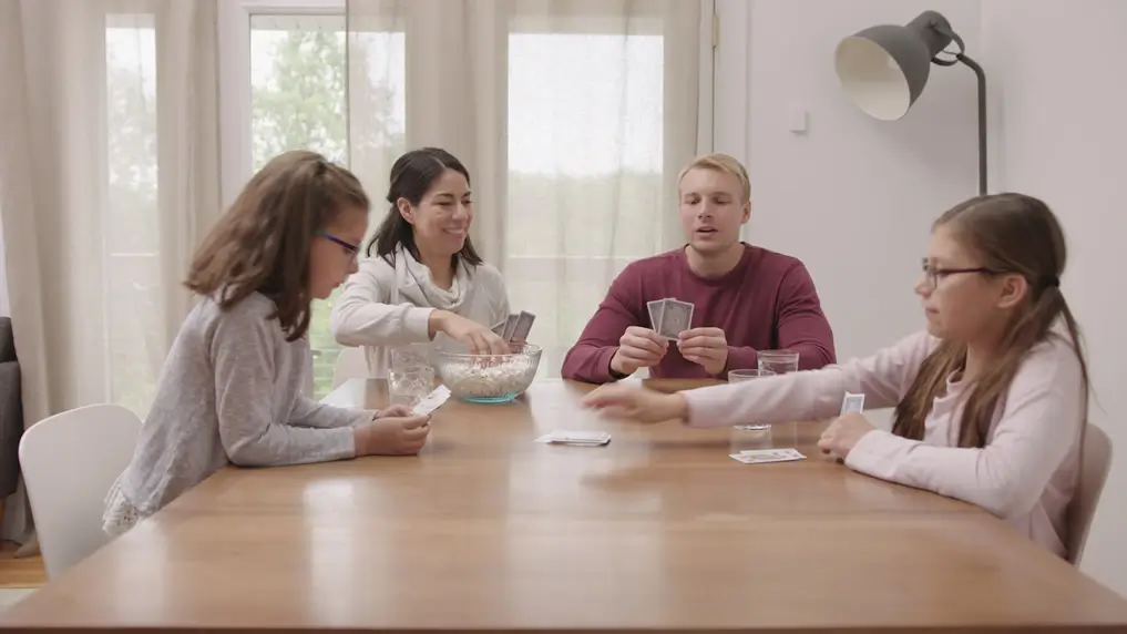 Family plying card games in humidified air conditioning.