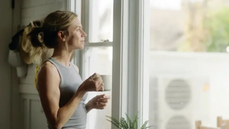 Woman in kitchen with coffee mug in Air Conditioning by Grant Mechanical